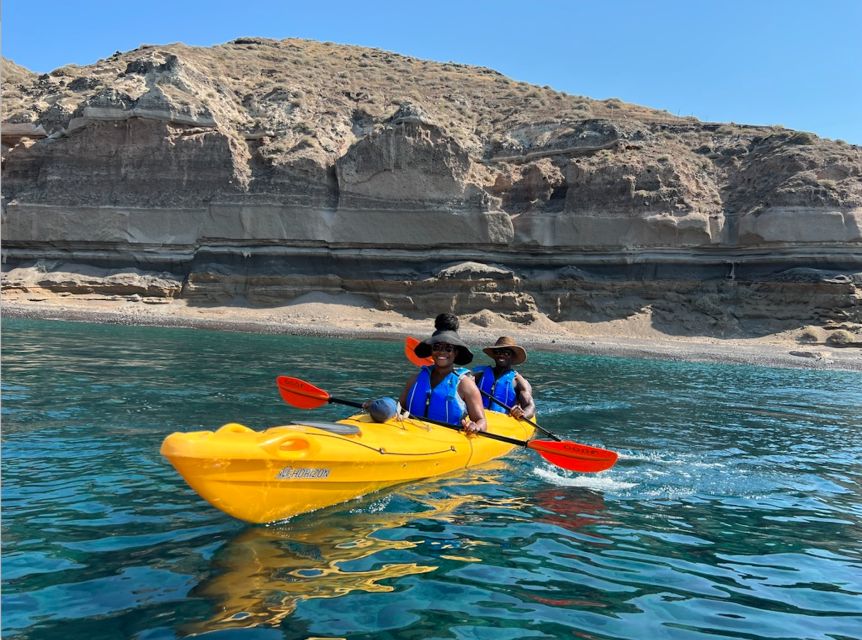 Santorini: Sea Caves Kayak Trip with Snorkeling and Picnic - Entering the blue sea caves