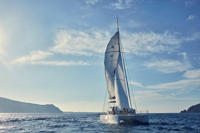 Santorini Sunset Luxury Sailing Catamaran Cruise with BBQ, drinks, transfer - Sunset from the water instead of Oia’s crowded cliffs