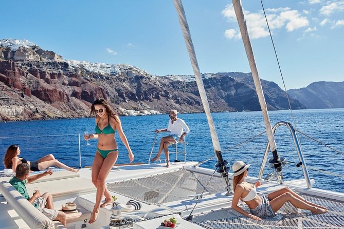 Santorini Sunset Luxury Sailing Catamaran Cruise with BBQ, drinks, transfer - Hotel pickup and boarding at Vlychada Port