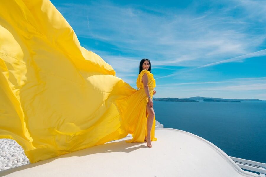 Santorini: Unique Flying Dress Photoshoot Experience - Oia’s blue domes and whitewashed backdrops