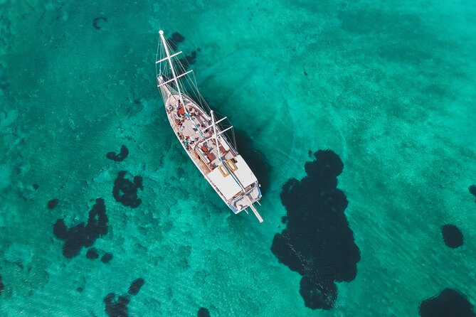 Sunset Dinner Cruise: Sunset, Swim, Drinks, and Dinner Onboard - Ydrousa and the two swimming stops
